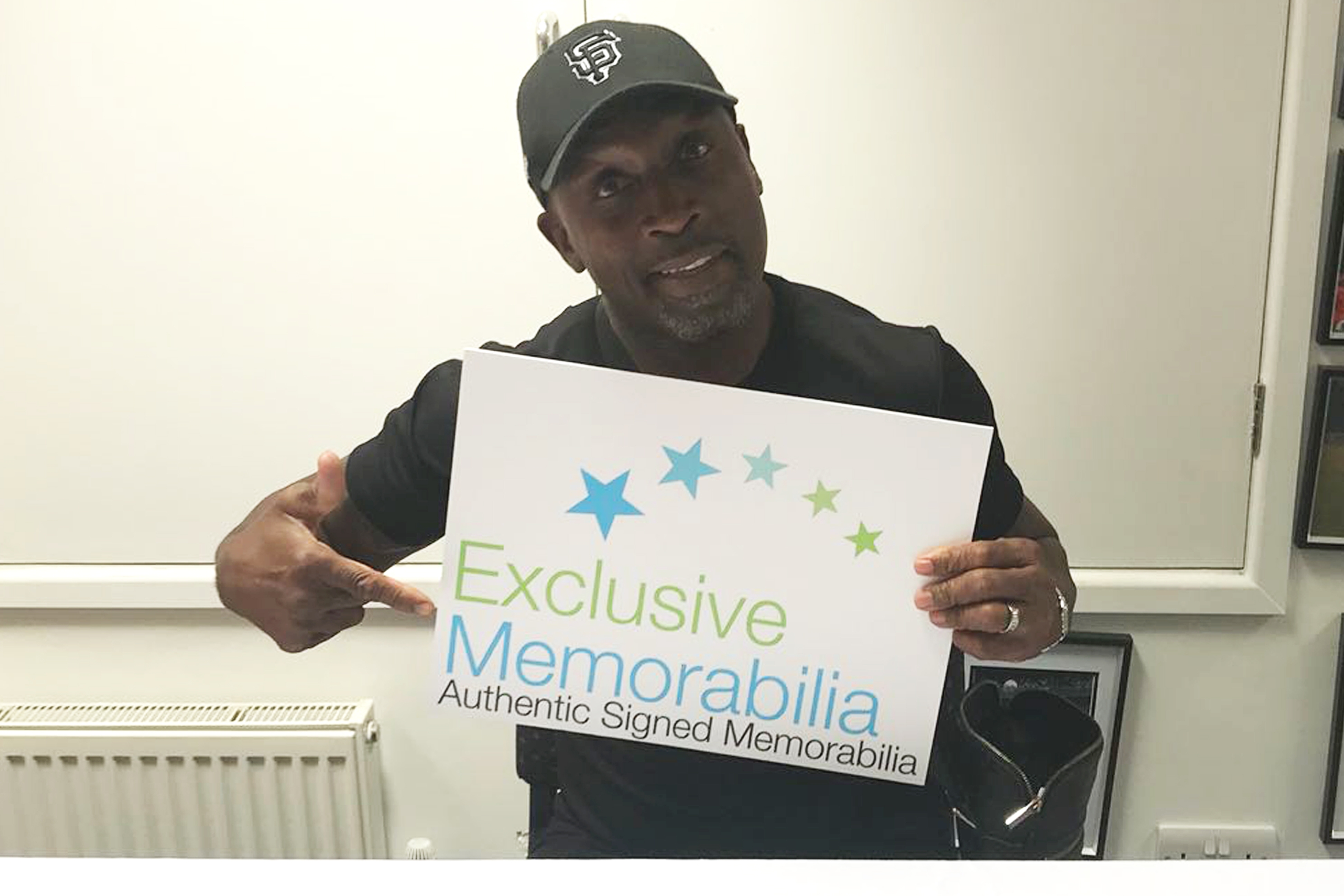 Nigel Benn signs for Exclusive Memorabilia 