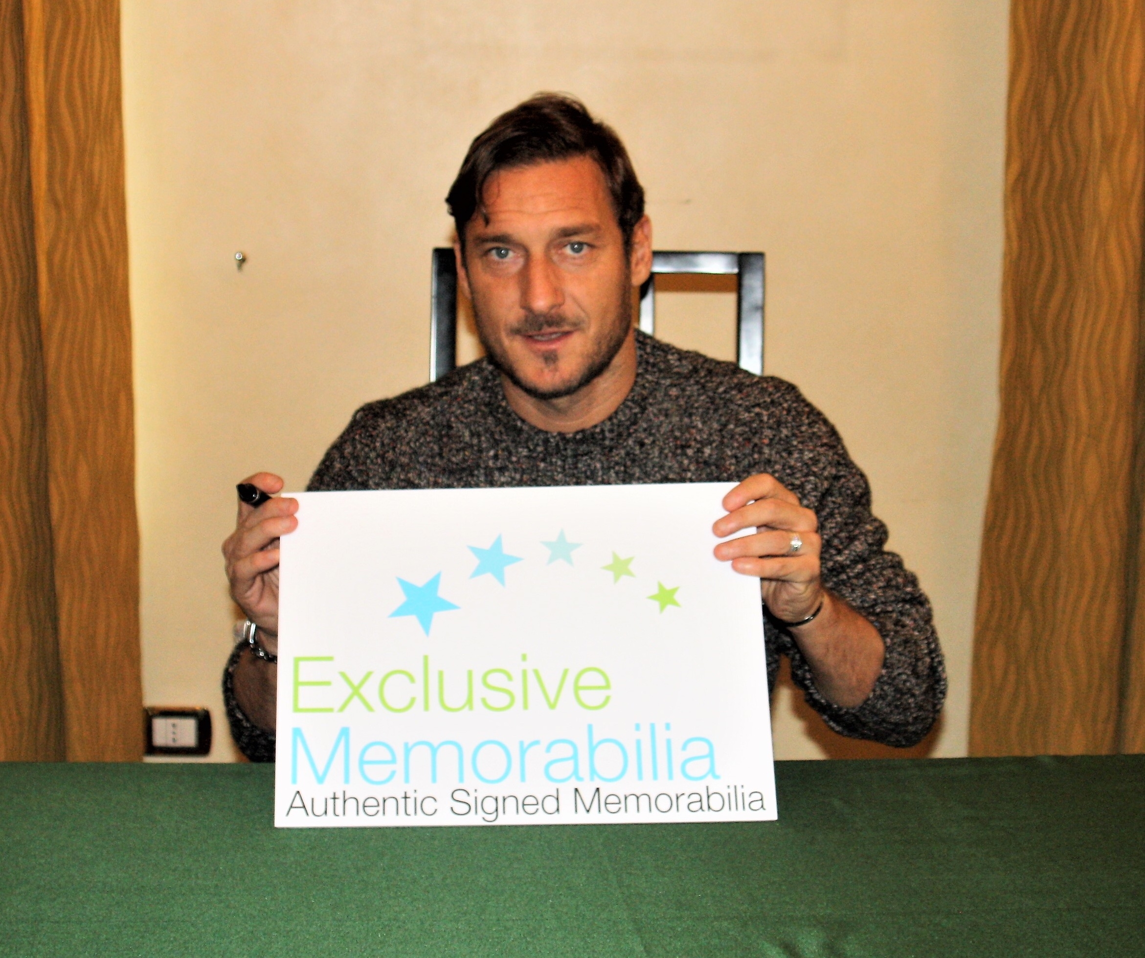 Totti Signing for Exclusive Memorabilia